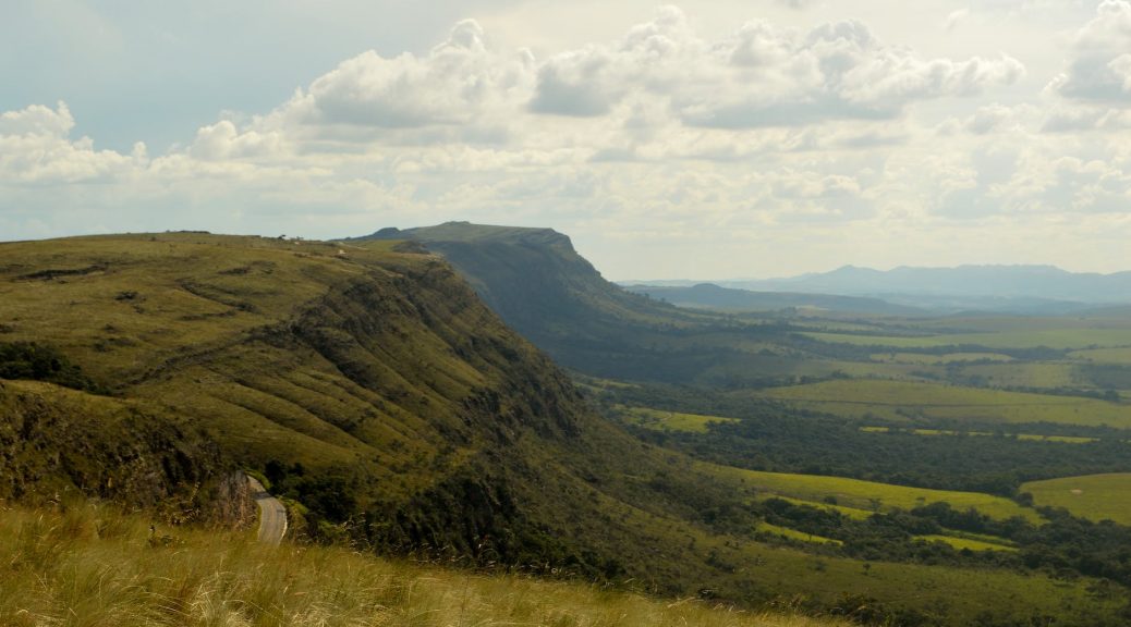 green valleys under cloudy sky