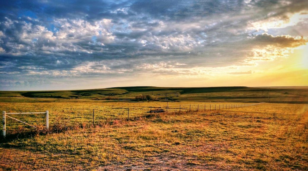 clouds at sunrise over rural landscape